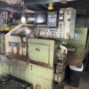 OKUMA LB15 CNC Lathe 1990 with OSP5020L-G control and feeder